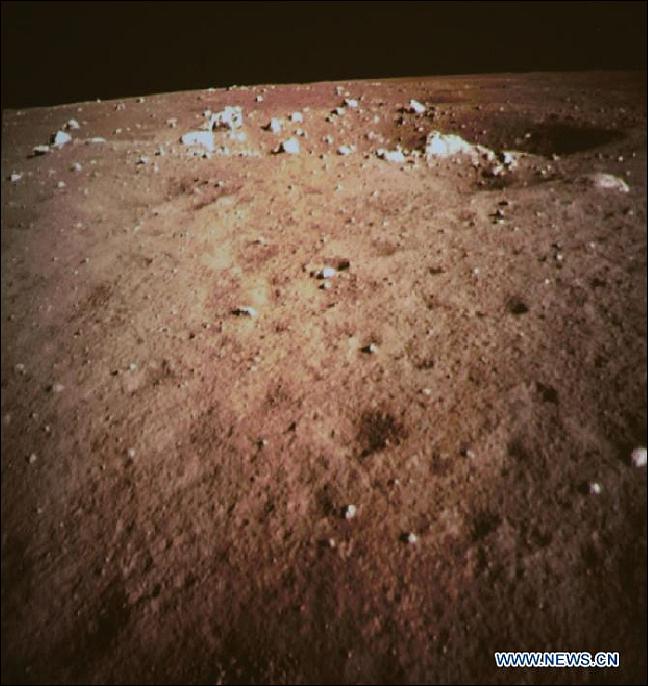 Figure 13: Photo of the moon's surface acquired on Dec. 14, 2013 during the lander descend; the picture was taken by the on-board camera of the lunar probe, and was displayed on the screen of the BACC in Beijing (image credit: Xinhua) 29)