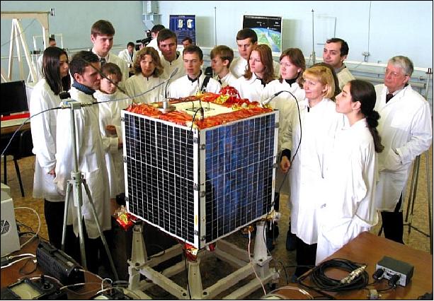 Figure 1: The Baumanets-1 microsatellite and some members of the development team (image credit: BMSTU)