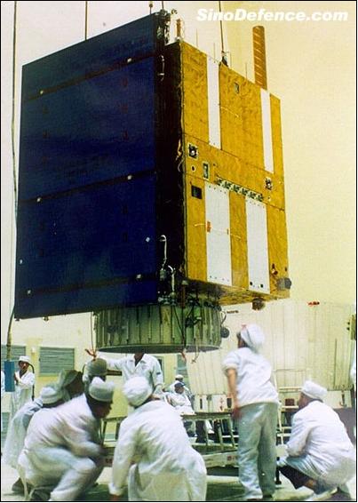 Figure 2: Chinese technicians examining the ZY-1 spacecraft at CAST (image credit: CAST)