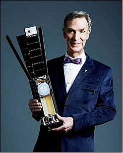 Figure 18: Bill Nye with a full-scale engineering model mockup of the LightSail 3U CubeSat developed by Stellar Exploration, Inc. (image credit: LightSail Team)