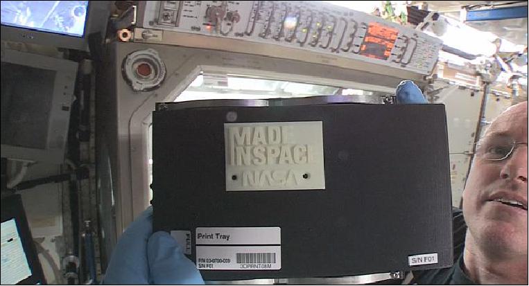 Figure 7: ISS Commander Barry "Butch" Wilmore holds up the first 3-D printed part made in space (image credit: Made In Space, NASA)