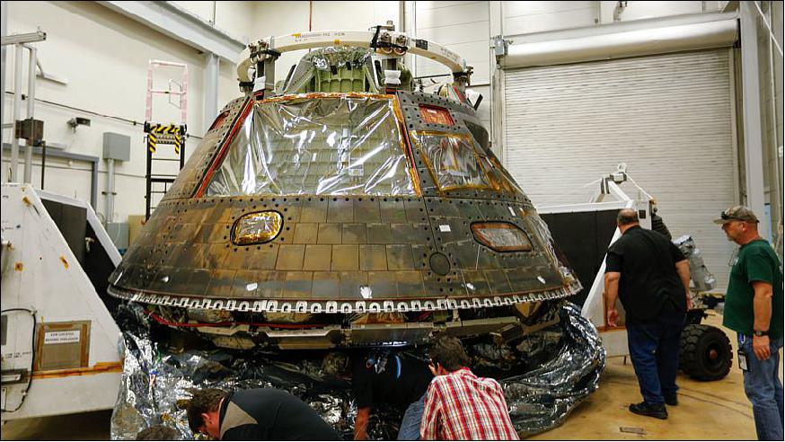 Figure 14: Engineers at Lockheed Martin's facility near Denver examine Orion EFT-1 upon its arrival (image credit: Lockheed Martin)