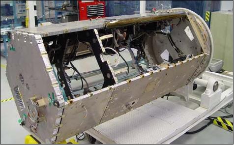 Figure 2: Photo of the bus structure in the early integration process of the spacecraft (image credit: OSC, JPL)
