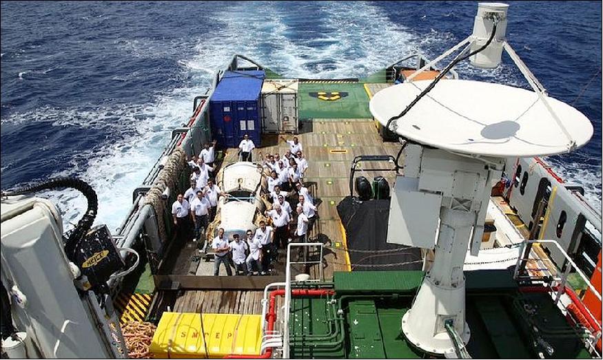 Figure 35: Photo of the recovered IXV on the Nos Aries deck surrounded by the recovery team (image credit: ESA)