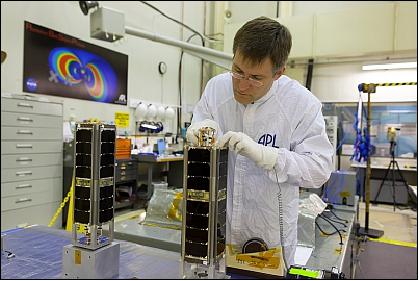 Figure 3: A technician at APL prepares the twin MBD nanosatellites for testing (image credit: JHU/APL)