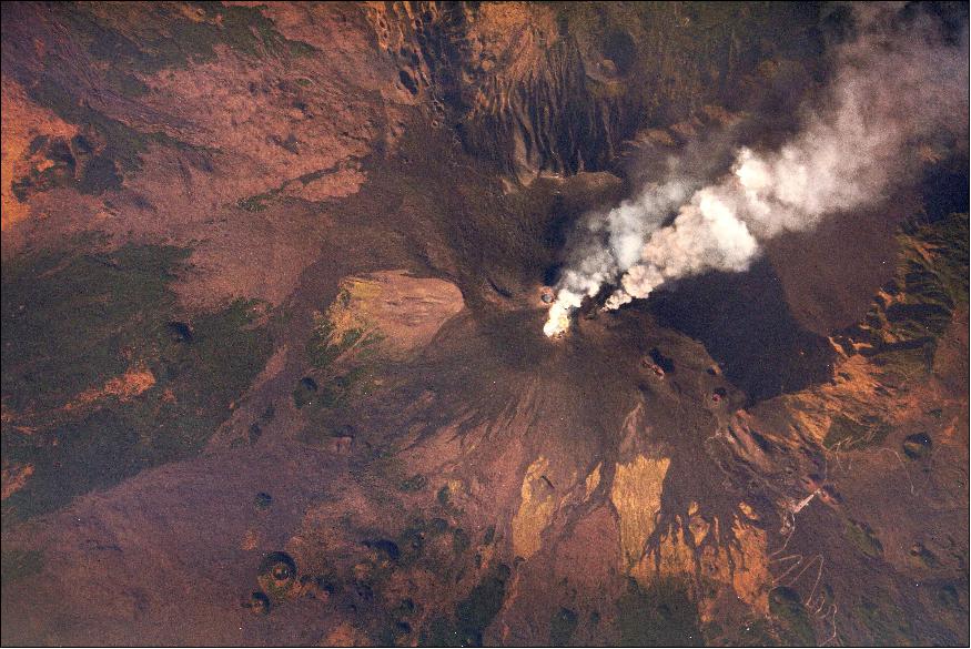 Figure 18: Mount Etna, acquired by the ISS SERVIR Environmental Research and Visualization System (ISERV) near sunset on July 2, 2014, shows the active central peak surrounded by hundreds of vents and cinder cones.