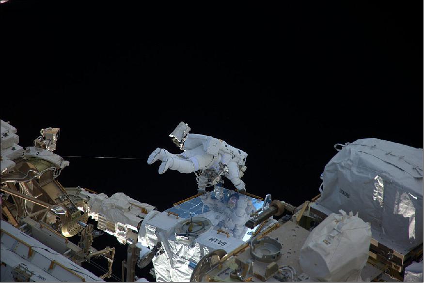 Figure 19: Thomas Pesquet is seen here at the external pallet of Japan's HTV-6 supply ship retrieving battery adapters to install closer to the Station's solar arrays (image credit: Roscosmos,O. Novitsky)