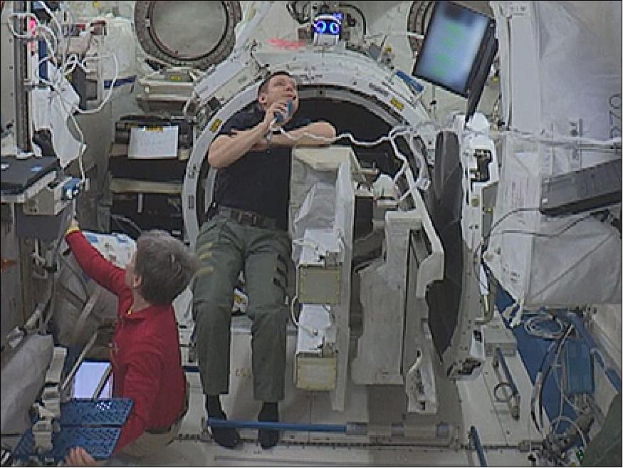 Figure 8: NASA astronauts Peggy Whitson and Jack Fischer work on the ISS as Int-Ball observes (top middle of image), image credit: JAXA/NASA