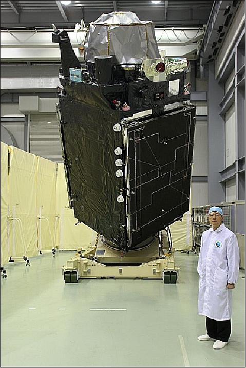 Figure 12: Photo of the QZS-1 spacecraft (nickname Michibiki) and project manager Koji Terada (image credit: JAXA)