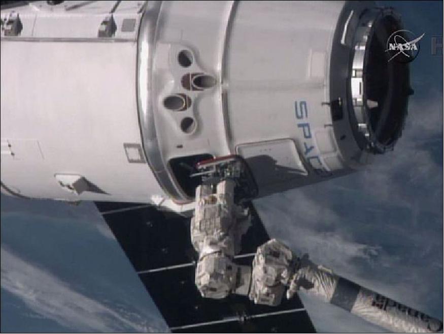 Figure 25: The Canadarm2 has the SpaceX Dragon in its grips on Jan 12, 2015 (image credit: NASA TV)