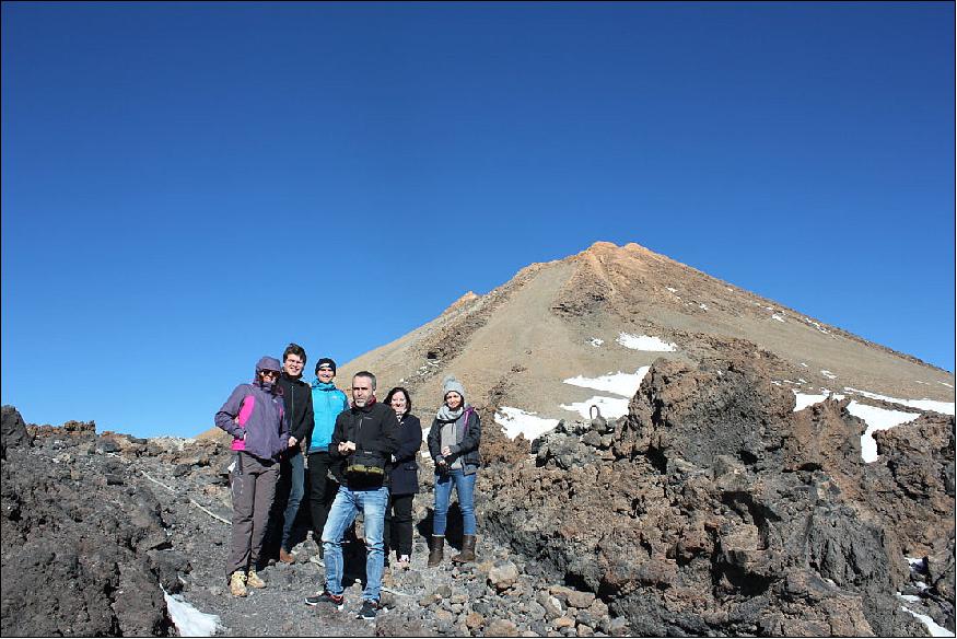 Figure 4: The lunar calibration project team on Mount Teide in Tenerife, having put their photometer in place. From left to right: Africa Barreto (University of Valladolid), Stefan Adriaensen (VITO), Marc Bouvet (ESA/ESTEC), Alberto Berjon (University of Valladolid), Claire Greenwell (NPL), Sarah Taylor (NPL). Not present but part of the team Carlos Toledano (University of Valladolid), Maria Garcia-Miranda (NPL), and Emma Woolliams (NPL), image credit: ESA 3)
