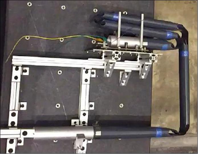 Figure 17: Boom after first stage deployment – Note the "Dog-Bone" slotted-hinges developed by H.M.Y.C. Mallikarachchi and S. Pellegrino (2008-12), image credit: AAReST collaboration