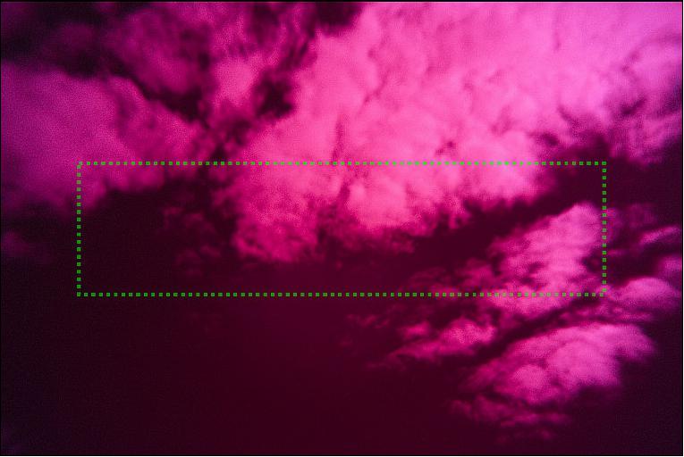 Figure 10: Ground-based photograph of a cloudy sky taken with the nadir objective mounted on a Canon camera house with a full frame sensor (35 mm). The dashed green rectangle denotes the cropped field of view as it will be seen with the MATS CCD sensor (image credit: MATS collaboration)