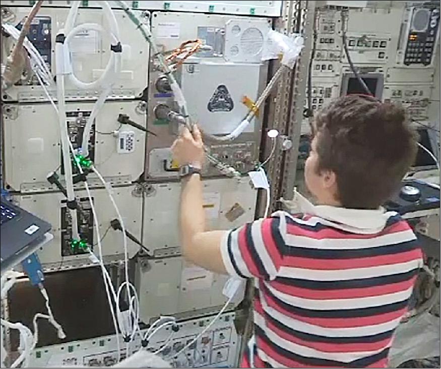 Figure 2: NASA astronaut Anne McClain installs the Refabricator aboard the ISS (image credit: NASA/Tethers Unlimited)