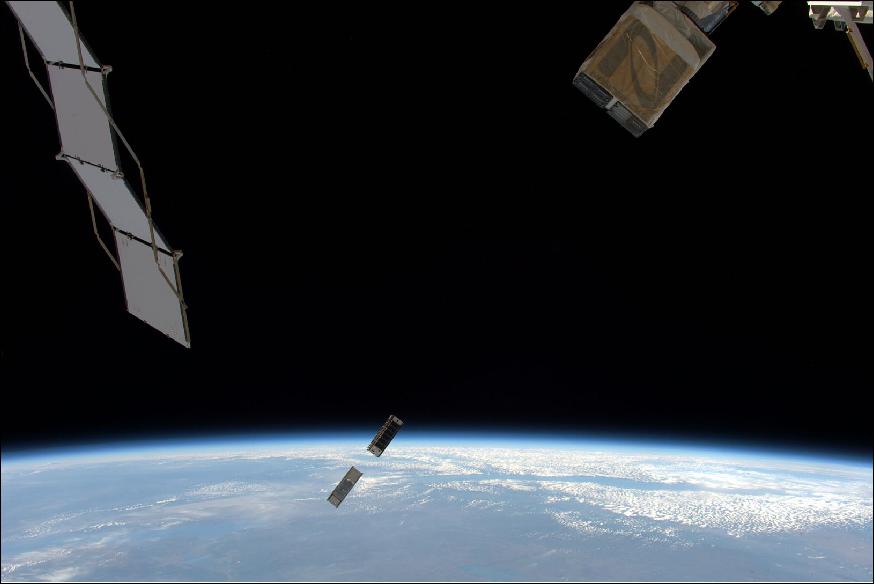 Figure 18: Astronaut Tim Peake on board the International Space Station captured this image of a CubeSat deployment on May 16, 2016. The bottom-most CubeSat is the NASA-funded MinXSS CubeSat, which observes soft X-rays from the sun—such X-rays can disturb the ionosphere and thereby hamper radio and GPS signals. The other nanosatellite is CADRE of the University of Michigan (image credit: ESA, NASA)