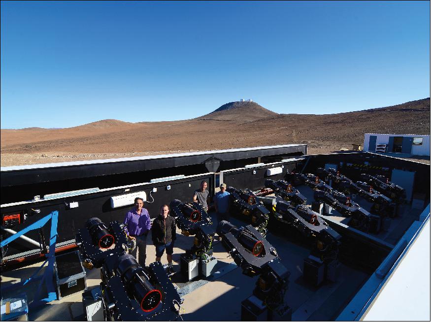 Figure 4: Photograph of the NGTS facility at Paranal with the VLT in the background to the west (image credit: NGTS consortium)