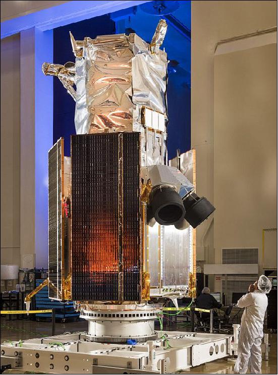 Figure 3: Photo of the WorldView-4 spacecraft. Employees at Lockheed Martin completing final preparations of the WorldView-4 imaging satellite (image credit: Lockheed Martin)