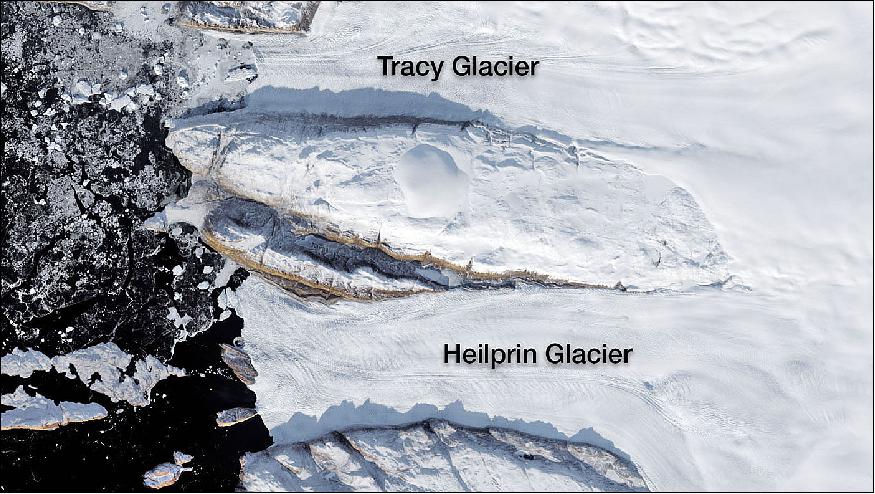 Figure 30: Tracy and Heilprin glaciers in northwest Greenland. The two glaciers flow into a fjord that appears black in this image (image credit: NASA)