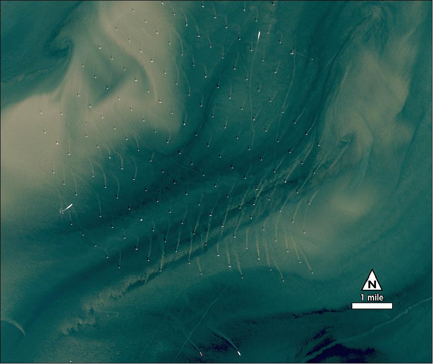 Figure 108: Close-up of the Thames Estuary wind power turbines of the London Array and sediment swirls on the coast of England (image credit: NASA, USGS)