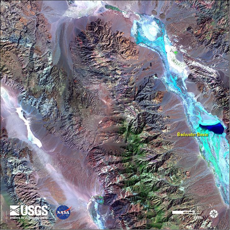 Figure 85: A false-color Landsat-8 image highlights hydrogeology in Death Valley after a major flooding event, acquired on Oct. 26, 2015; the areas in green to blue are locations with moisture content. Especially striking is the Badwater Basin, normally a dry lakebed, which became full of water( image credit: USGS, NASA)
