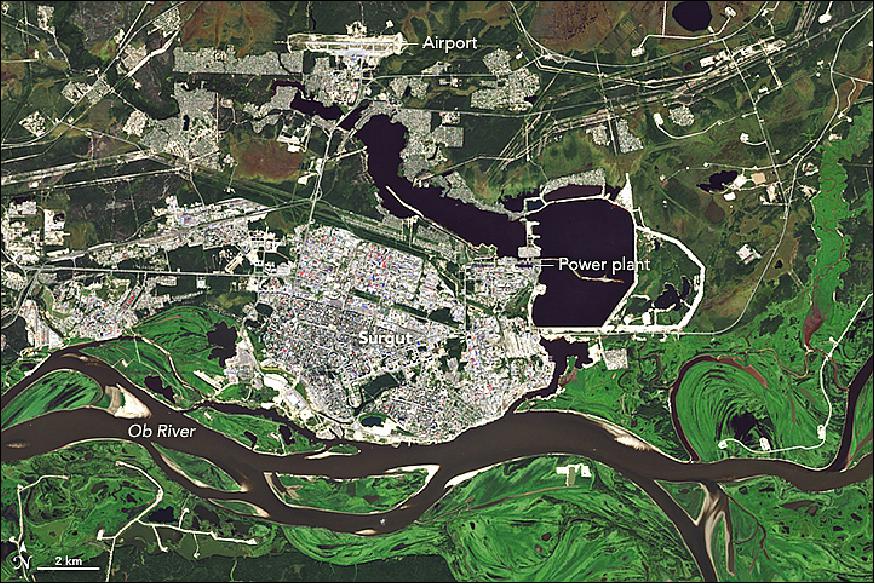 Figure 47: Detail image. OLI on Landsat-8 collected this natural-color image of the city and its surroundings on August 22, 2016. Gas and oil infrastructure spreads across marshlands northeast of the city, and there is another sizable oil field southeast of the neighboring city of Nefteyugansk (image credit: NASA Earth Observatory images by Mike Taylor and Joshua Stevens, using Landsat data from the U.S. Geological Survey, story by Adam Voiland)