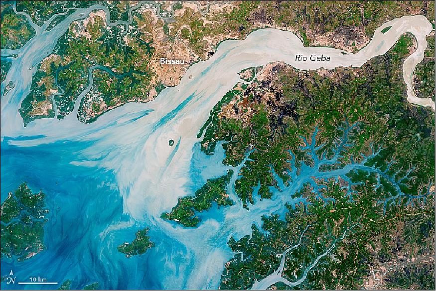 Figure 38: This natural–color image captures the movement of the sediments as the rivers move east to west. The image was acquired on May 17, 2018, by the Operational Land Imager (OLI) on Landsat 8. The discoloration is most apparent in Rio Geba, which runs past the country's capital city of Bissau (image credit: NASA Earth Observatory image by Joshua Stevens, using Landsat data from the USGS. Story by Kasha Patel)