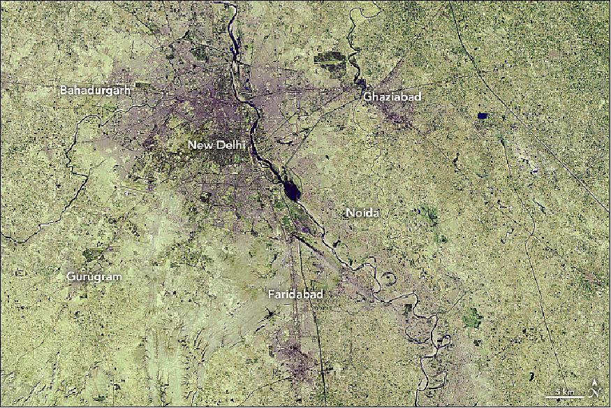 Figure 22: False-color image of New Delhi acquired with the TM (Thematic Imager) of Landsat-5 on 5 December 1989 (image credit: NASA Earth Observatory, image by Lauren Dauphin, using Landsat data from the U.S. Geological Survey. Story by Kasha Patel)