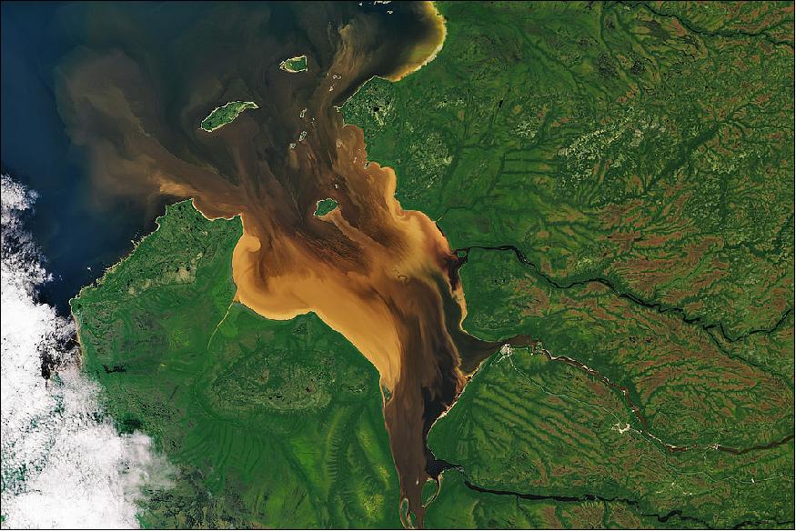 Figure 64: Remote Rupert Bay in northern Quebec (Canada) is a place where the majesty and dynamism of fluid dynamics is regularly on display. With several rivers pouring into this nook of James Bay, the collision of river and sea water combines with the churn of tides and the motion of currents past islands to make swirls of colorful fluid that could impress even the most jaded of baristas (image credit: NASA Earth Observatory)