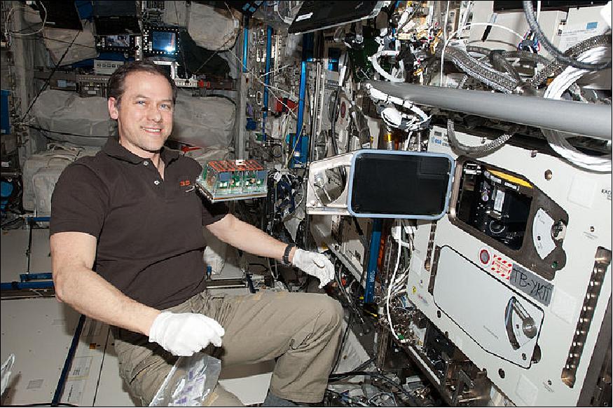 Figure 12: Growing seedlings: NASA astronaut Tom Marshburn with the Seedling Growth-1 seeds ready to load into the EMCS (European Modular Cultivation System) on the International Space Station (image credit: ESA/NASA)
