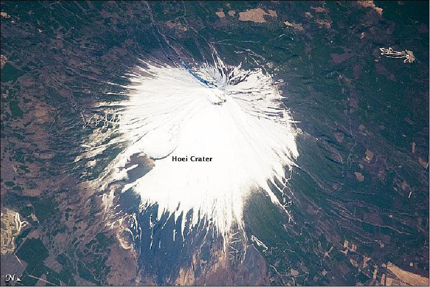 Figure 98: Mount Fuji image acquired on April 8, 2009 by the SRTM (Shuttle Radar Topographic Mission), taken by the Expedition 19 astronaut crew . This oblique (viewed at an angle, rather than straight down) astronaut photograph illustrates the snow-covered southeastern flank of the volcano. The northeastern flank is visible in this image (image credit: NASA Earth Observatory)