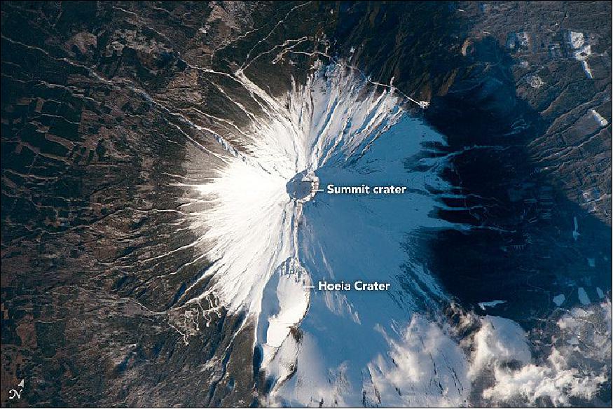 Figure 97: This astronaut photograph ISS046-E-35820 of Mount Fuji, Japan, was acquired on February 8, 2016, with a Nikon D4 digital camera using an 1150 mm lens, and is provided by the ISS Crew Earth Observations Facility and the Earth Science and Remote Sensing Unit, Johnson Space Center. The image was taken by a member of the Expedition 46 crew. (image credit: NASA Earth Observatory)