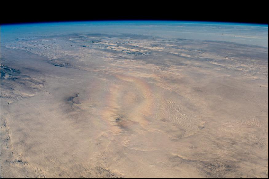 Figure 22: This picture is an even more rare example of a glory seen from space. Snapped by ESA astronaut Alexander Gerst on 14 September 2018 during his Horizons mission, he commented: 'Surprised to see a pilot's glory from the International Space Station, an optical phenomenon that is often visible from aircraft, or on volcanoes when looking down in a foggy crater, with Sun in the back. Our shadow is (theoretically) right in the middle of the rainbow, but we don't have a core shadow due to our altitude.' Image credit: ESA/NASA