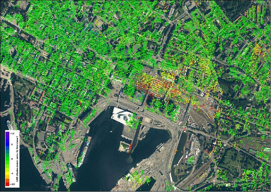 Figure 48: Data from the Sentinel-1 satellites acquired between 26 December 2014 and 28 October 2016 show that parts of the Oslo train station are sinking by 10–15 mm a year in the ‘line of sight’ – the direction that the satellite is ‘looking’ at the building. This translates into a vertical subsidence of 12–18 mm a year. It can also be observed that the new opera house – the white structure located by the fjord south of the subsiding area – has not moved (image credit: ESA, the image contains modified Copernicus Sentinel data (2015–16) / ESA SEOM INSARAP study / PPO.labs / Norut / NGU) 58)