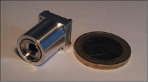 Figure 13: Photo of the highly miniaturized NanoFEEP thruster; the thruster is compared to a 1€ coin (image credit: TU Dresden)
