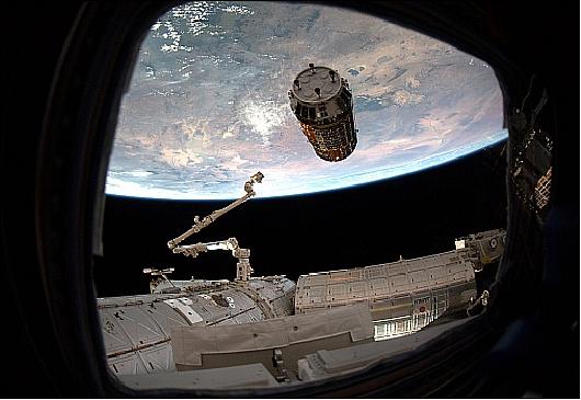 Figure 33: Photo of the HTV-2 arrival at the ISS with the extended Canadarm-2 (image credit: NASA)