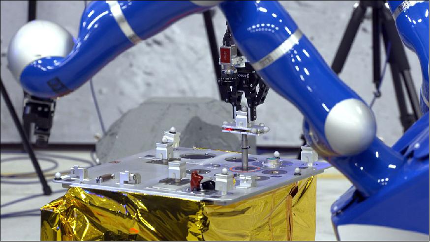 Figure 18: Photo of the Interact Rover at ESA/ESTEC, inserting the metal peg under remote control of ESA astronaut Andreas Mogensen aboard the ISS, into a hole with just 0.15 mm of clearance. The peg needed to be inserted 4 cm to make an electrical connection (image credit: ESA) 25)
