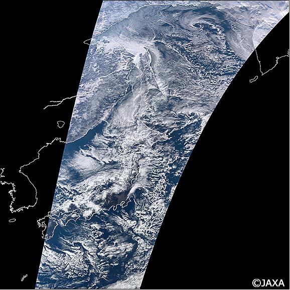 Figure 10: This image is a true color composite (reflectances of SGLI VN8, VN5, VN3 channels are assigned to red, green, and blue colors) image of 250 m spatial resolution captured over the Okhotsuk Sea and Japan Islands with SGLI onboard the SHIKISAI around 10:20 (JST) on 6 January 2018. Snow, sea ice, and clouds are shown in white. Land and ocean areas are seen in dark brown and blue colors (image credit: JAXA/EORC)