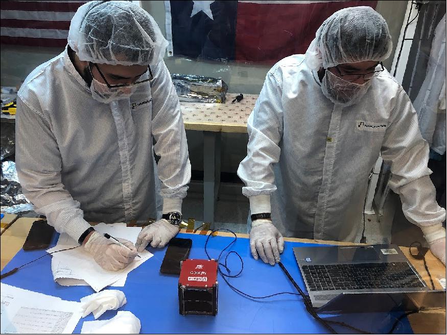 Figure 2: Jose Cortez of NASA Ames (left) and Joel Contreras of UPAEP (right), conduct final integration of AzTechSat-1 into the Nanoracks CubeSat Deployer (NRCSD) in preparation for launch to the International Space Station (image credit: NASA)