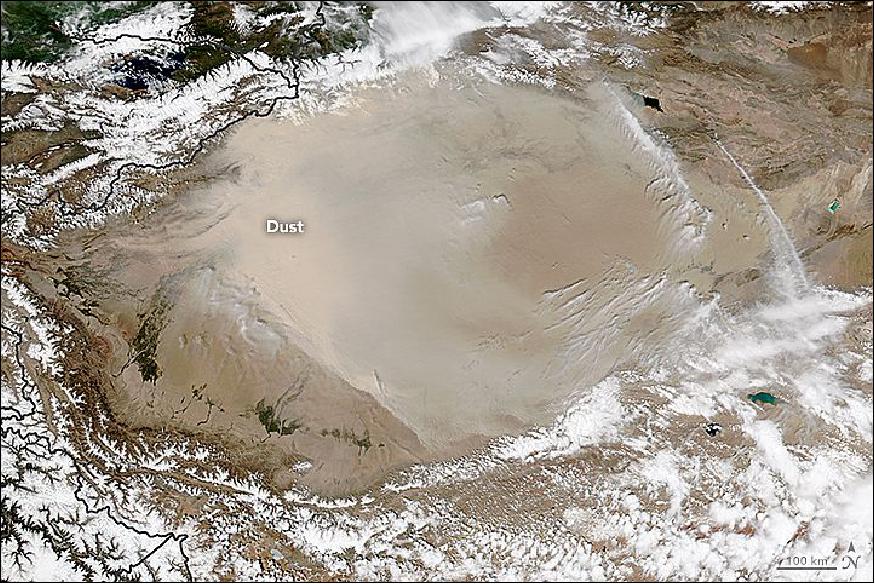 Figure 72: On May 1, 2016, the VIIRS (Visible Infrared Imaging Radiometer Suite) on the Suomi NPP satellite captured this natural-color image of northeasterly winds pushing a wall of dust southwest across the Tarim Basin (image credit: NASA Earth Observatory, image by Jeff Schmaltz)
