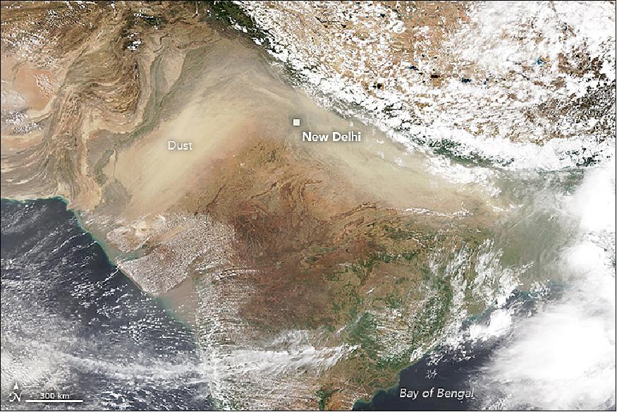Figure 18: A dust storm originated in the western state of Rajasthan on June 12, 2018, as high winds kicked up dust from the Thar desert. Over the next few days, the dust traveled across north-central India. This image was acquired on June 14 by the VIIRS (Visible Infrared Imaging Radiometer Suite) on the Suomi NPP satellite. The dust was trapped between mountain ranges and appears in the shape of upside down "v" on the image (image credit: NASA Earth Observatory images by Lauren Dauphin, using VIIRS data from the Suomi NPP satellite)