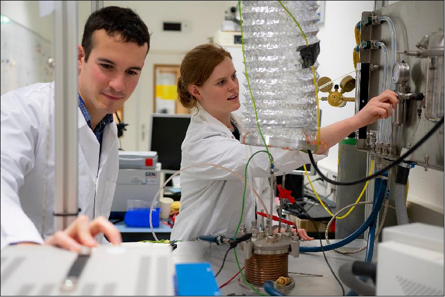 Figure 2: ESA research fellow Alexandre Meurisse and Beth Lomax of the University of Glasgow producing oxygen and metal out of simulated moondust inside ESA's Materials and Electrical Components Laboratory (image credit: ESA, A. Conigili)