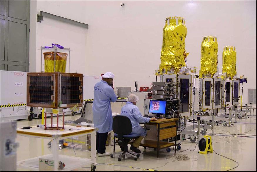 Figure 9: Photo of CBNT-1 microsatellite (left) and three DMC-3 minisatellites (right) in the cleanroom at SDSC SHAR (image credit: ISRO)