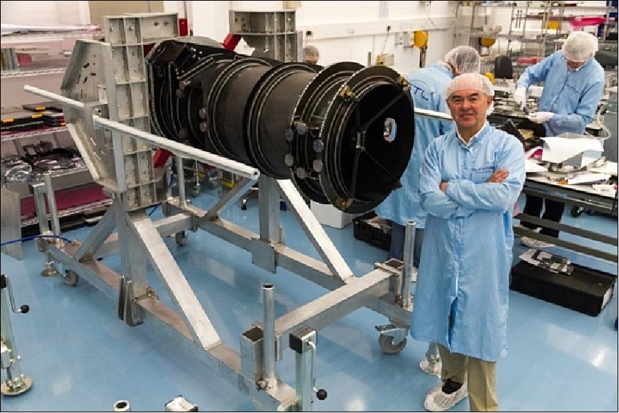 Figure 6: Photo of Sir Martin Sweeting with the DMC-3 imager barrel (image credit: SSTL)