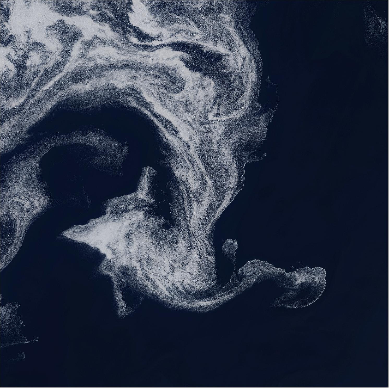 Figure 21: In this image captured on 9 June 2019, small pieces of sea ice, known as ice floes, trace out the ocean currents beneath, resulting in a large swirl-like feature of approximately 120 km in diameter. This image is also featured on the Earth from Space video program (image credit: ESA, the image contains modified Copernicus Sentinel data (2019), processed by ESA, CC BY-SA 3.0 IGO)