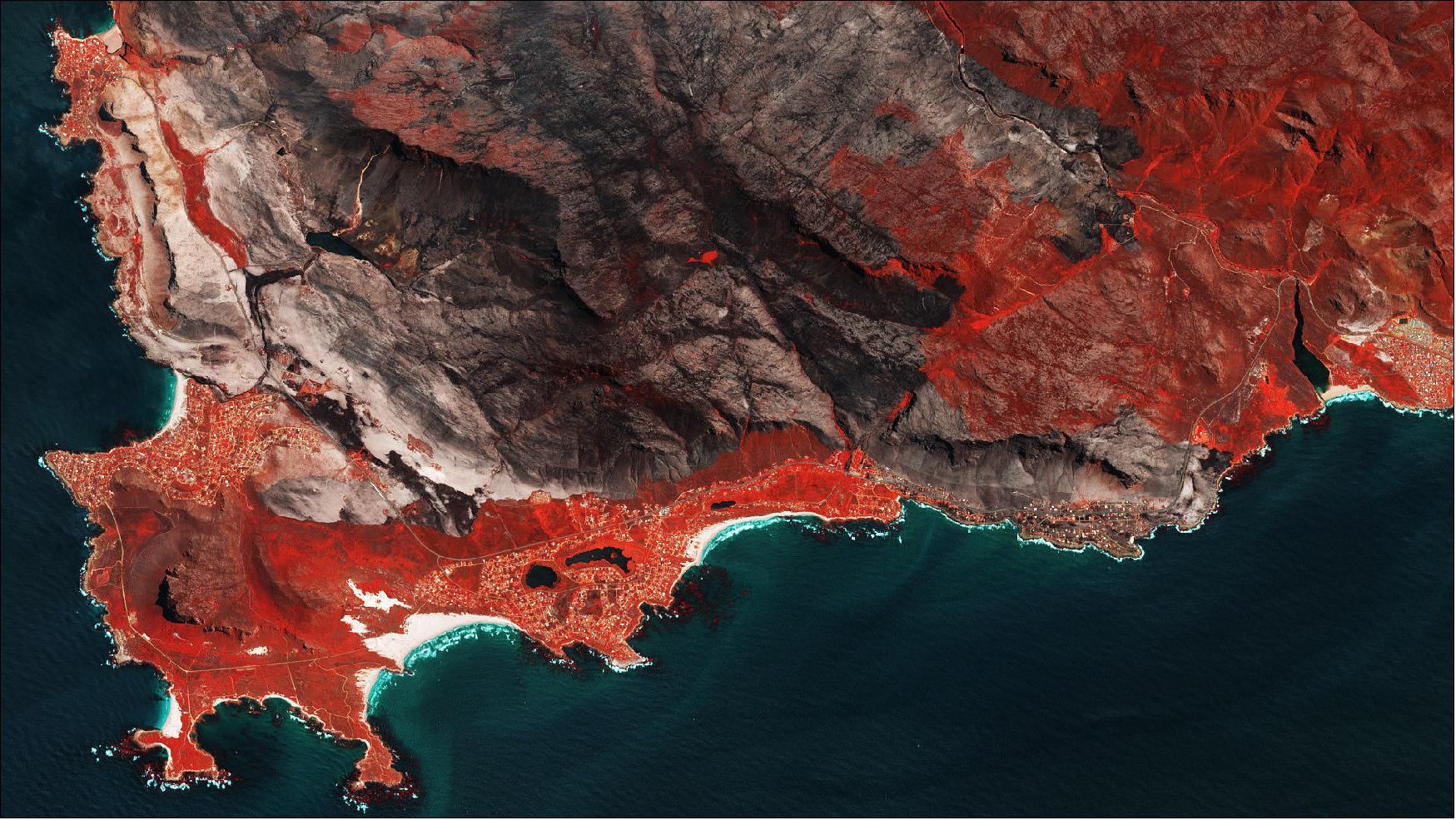 Figure 52: This Copernicus Sentinel-2 image from 26 January 2019 shows fire-scarred land near the Betty’s Bay area of Cape Town in South Africa. This false-color image has been processed to show burned areas in dark greys and browns, and areas covered with vegetation are shown in red [image credit: ESA, the image contains modified Copernicus Sentinel data (2019), processed by ESA, CC BY-SA 3.0 IGO] 51)
