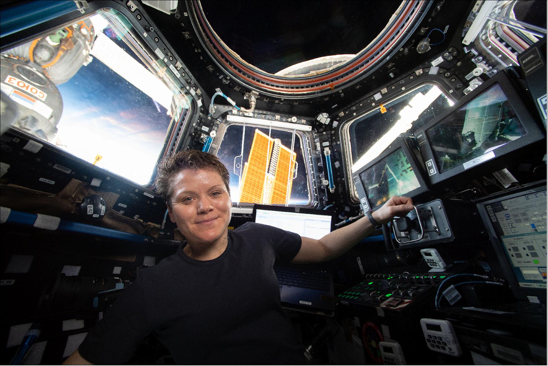 Figure 84: NASA astronaut Anne McClain in the Cupola module of the International Space Station takes a break while practising Canadarm2 robotics and Cygnus spacecraft capture techniques, 16 April 2019 (image credit: NASA)