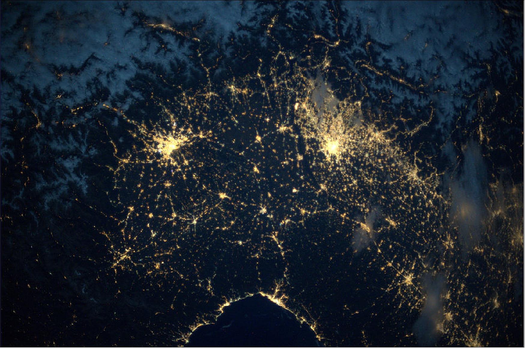 Figure 82: Northern Italy at night. The two big bright spots in the image are Turin at left and Milan at right (image credit: ESA, NASA)