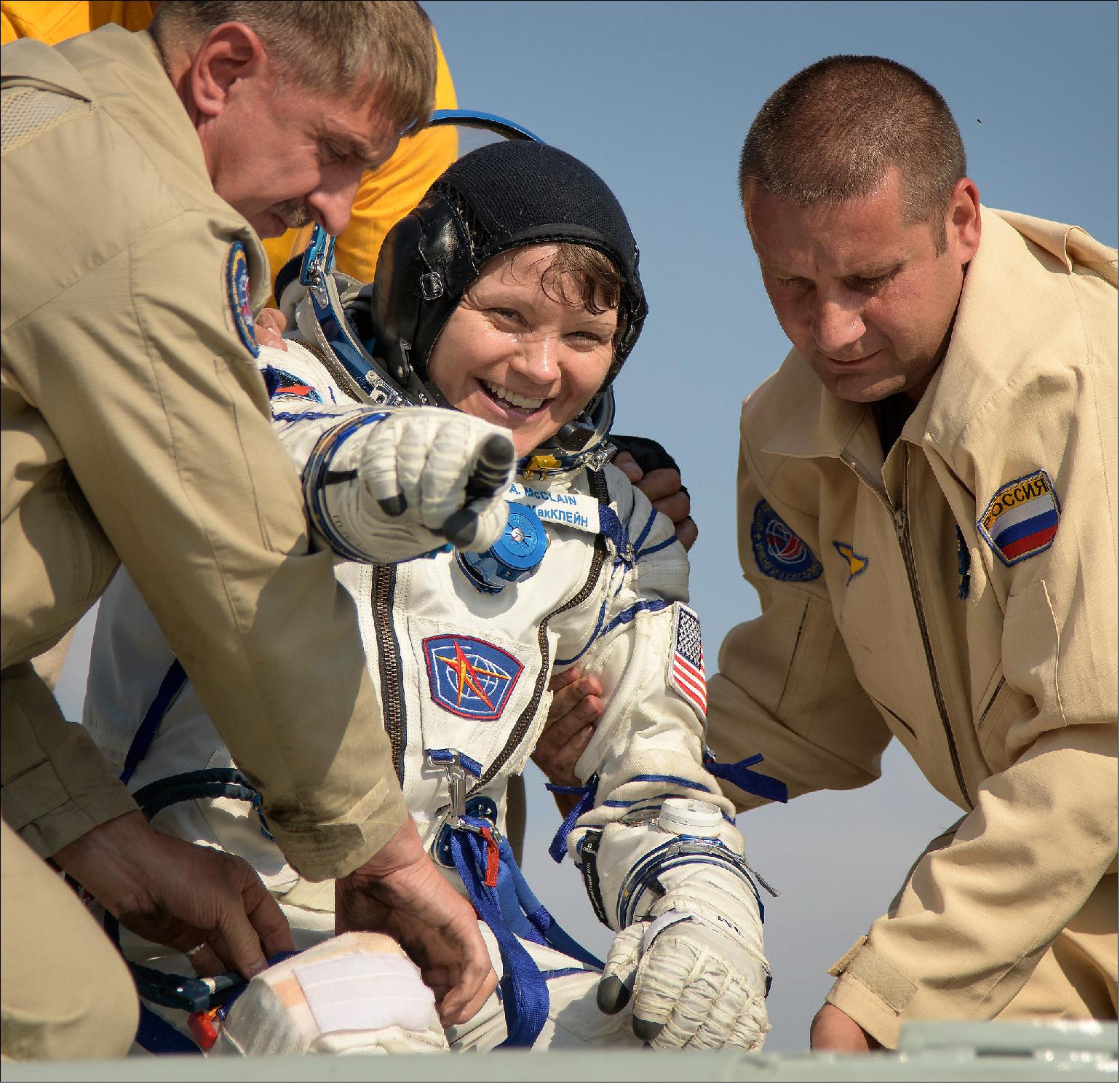 Figure 79: NASA astronaut Anne McClain is assisted out of the Soyuz MS-11 that returned her and crewmates Oleg Kononenko of the Russian space agency Roscosmos and David Saint-Jacques of the Canadian Space Agency back to Earth on June 24, 2019, landing in a remote area near Zhezkazgan, Kazakhstan, after 204 days aboard the International Space Station (image credit: NASA)