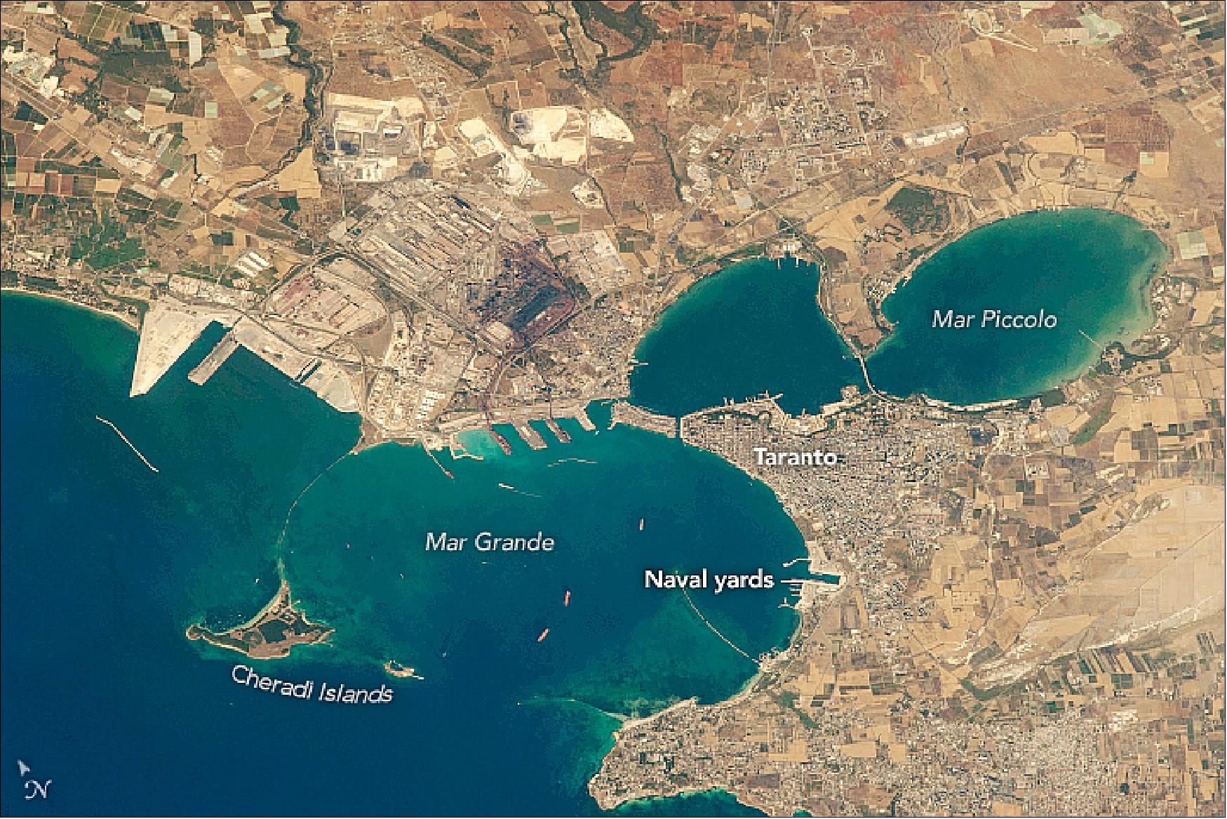 Figure 24: Italy’s major southern port and naval base has a history dating back to Roman times. This astronaut photograph ISS052-E-8449 was acquired on June 25, 2017, with a Nikon D4 digital camera using an 1150 millimeter lens and is provided by the ISS Crew Earth Observations Facility and the Earth Science and Remote Sensing Unit, Johnson Space Center. The image was taken by a member of the Expedition 52 crew (image credit: NASA Earth Observatory, caption by Justin Wilkinson)