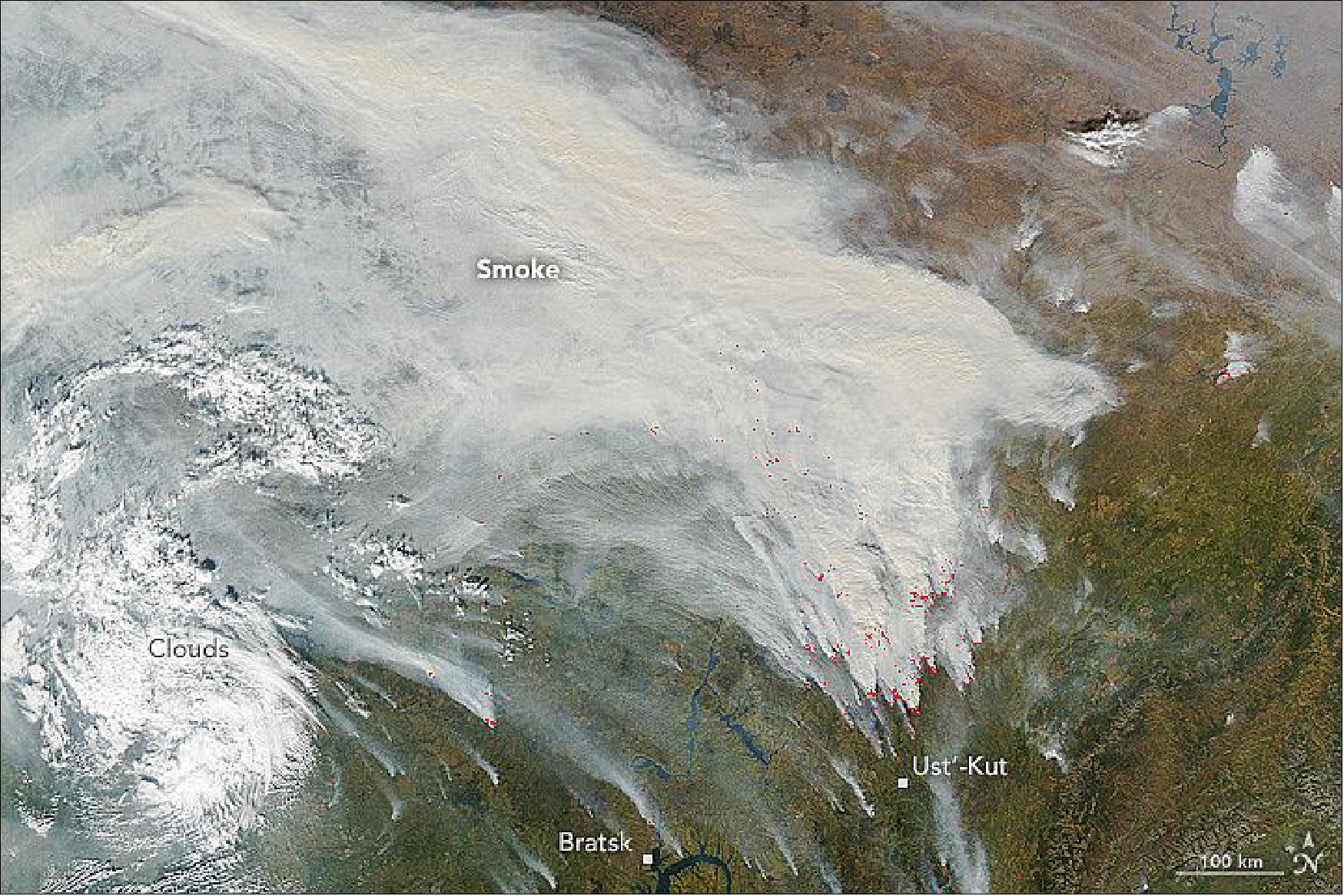 Figure 116: The natural-color image, acquired on Sept. 18, 2016 by the MODIS instrument on NASA’s Aqua satellite, shows huge plumes of smoke streaming toward the northwest. Areas in red show where MODIS detected unusually warm temperatures associated with fire (image credit: NASA Earth Observatory, image by Jeff Schmaltz)